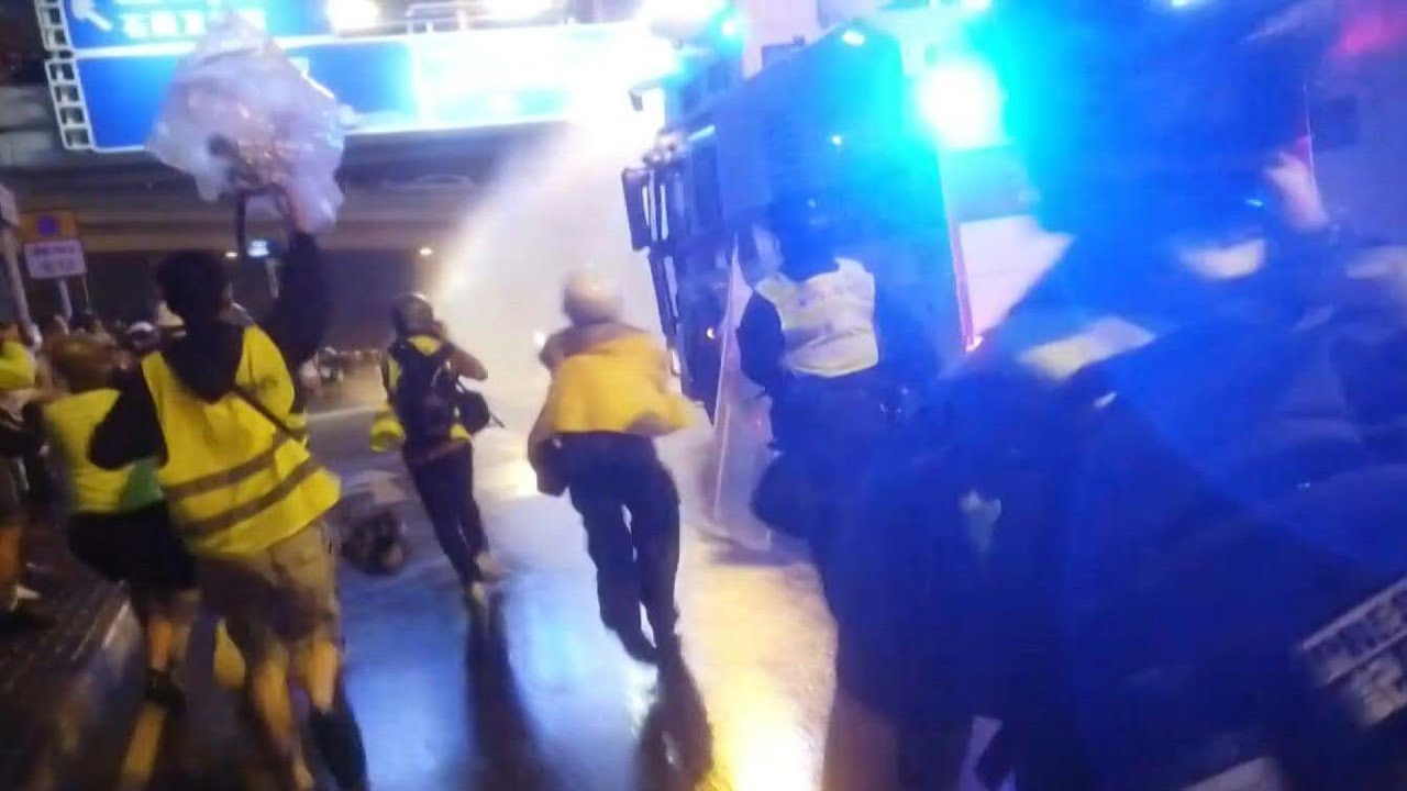 Hong Kong police use water cannon in latest clashes | AFP