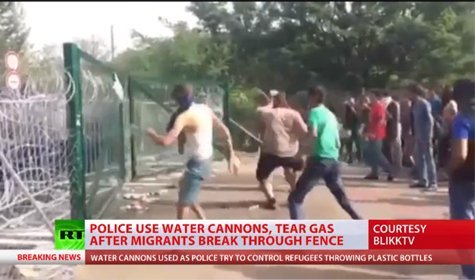 Riot Police Unleash Tear Gas, Water Cannons As Migrants Storm Hungarian Border Barriers [VIDEO]